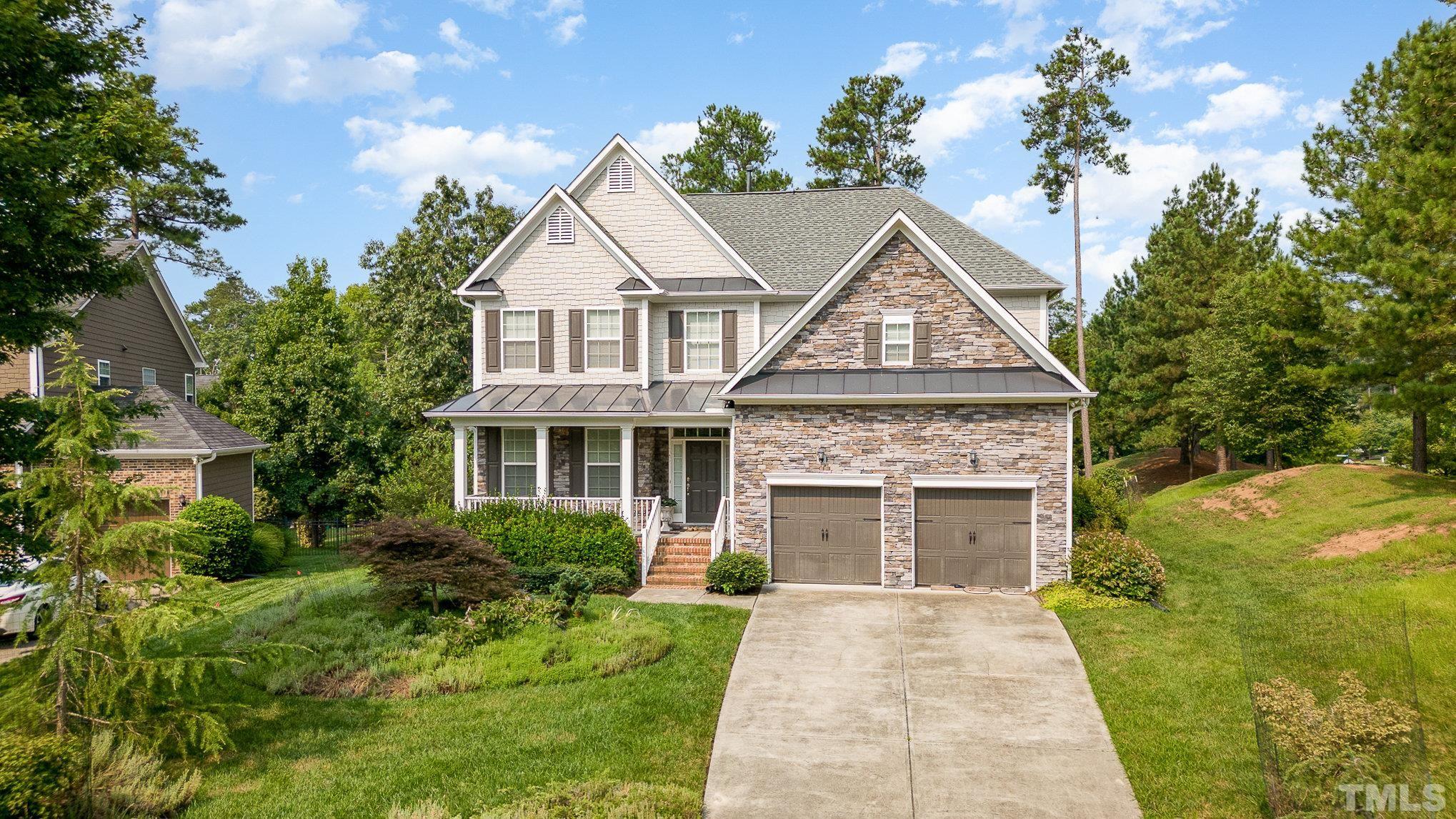 306 Few Circle Durham, NC 27705 - Photo 5 of 28 a view of house with garden and trees