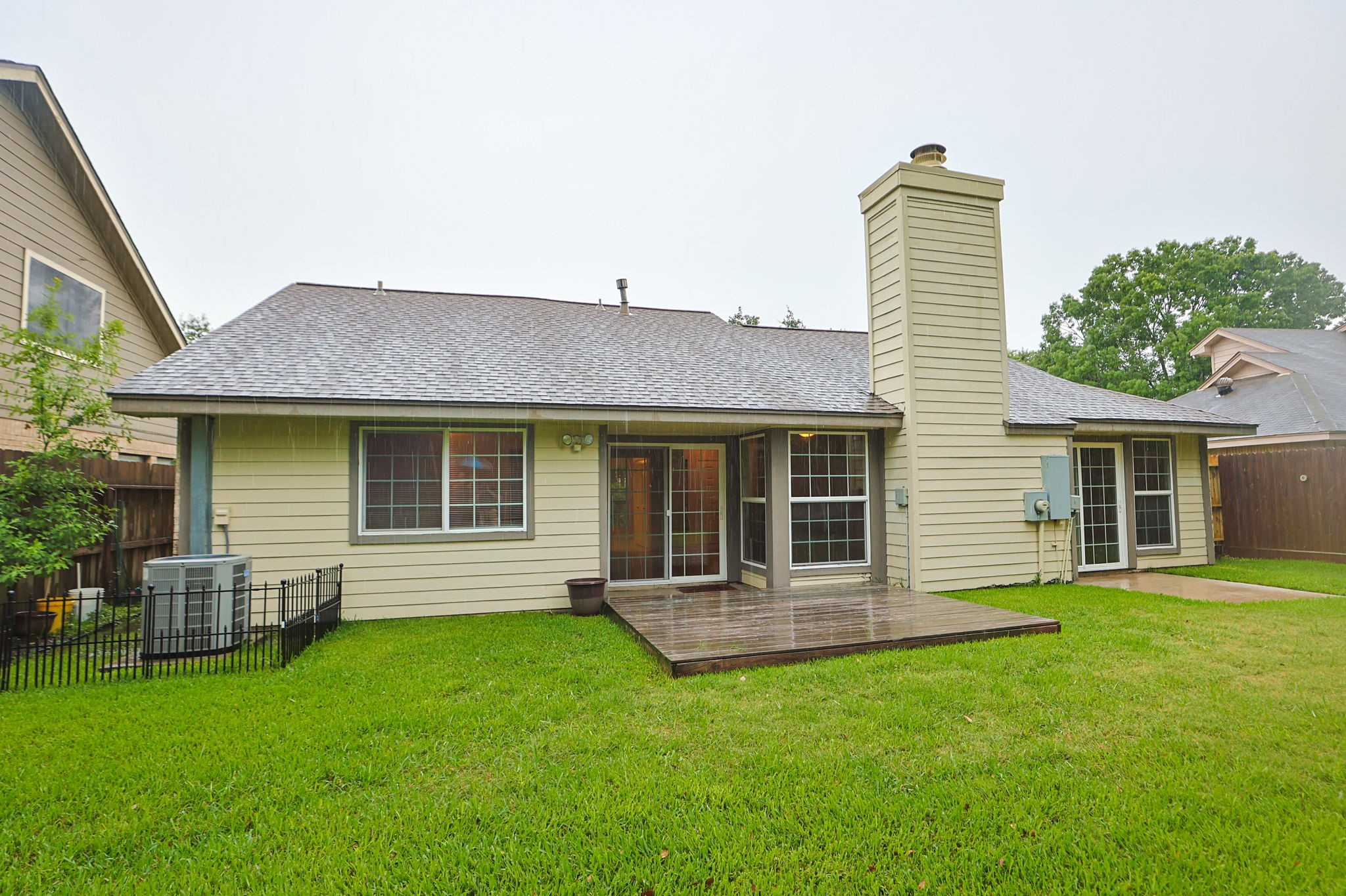 11947 Paddock Way Houston, TX 77065 - Photo 16 of 16 Great view of the back of the home with a deck and patio.
