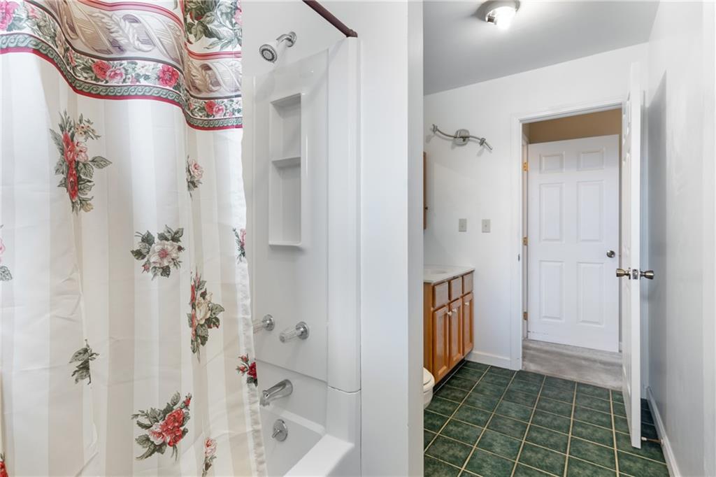 3298 Miola Road Clarion, PA 16214 - Photo 14 of 38 a bathroom with a bathtub sink and shower