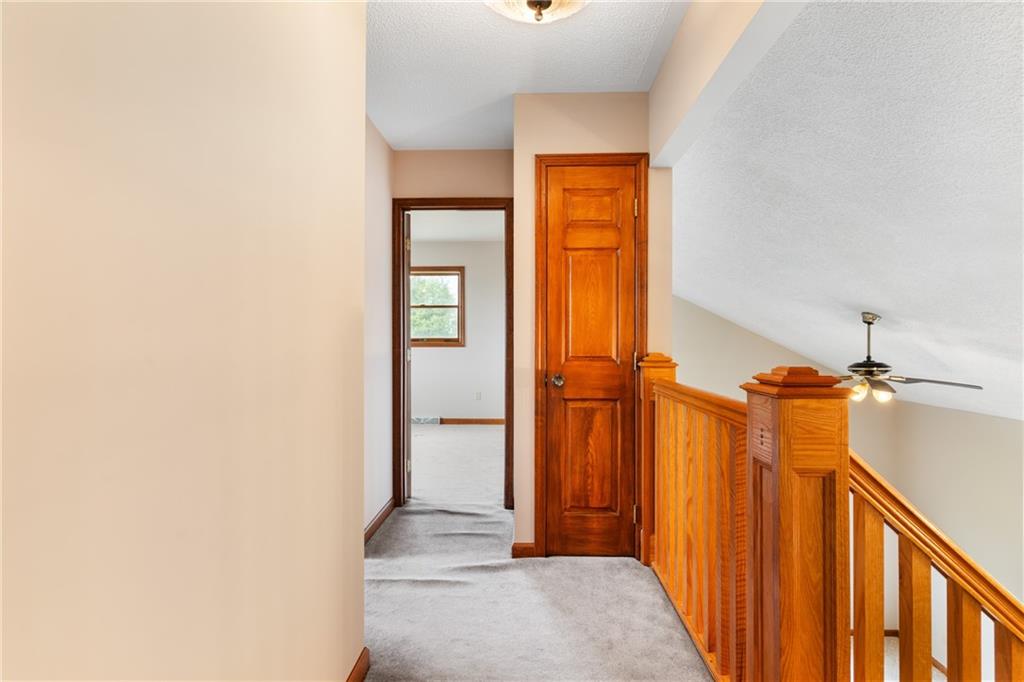 3298 Miola Road Clarion, PA 16214 - Photo 17 of 38 a view of a hallway with a door and wooden floor