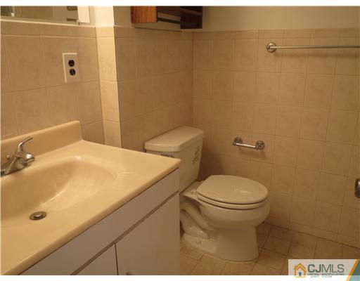 1 Barlow Road Edison, NJ 08817 - Photo 15 of 17 a bathroom with a sink and a toilet