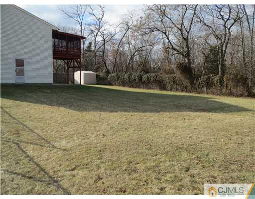 1 Barlow Road Edison, NJ 08817 - Photo 17 of 17 a view of a yard with wooden fence