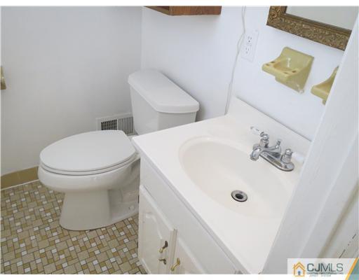 1 Barlow Road Edison, NJ 08817 - Photo 9 of 17 a bathroom with a sink and a toilet