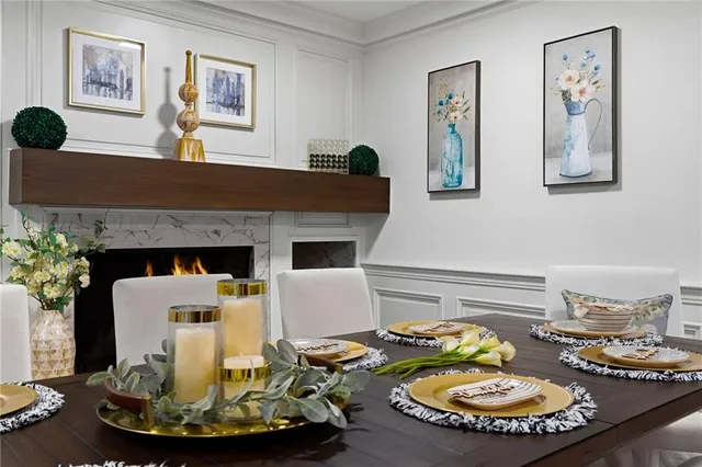 a kitchen with a sink white cabinets and white appliances
