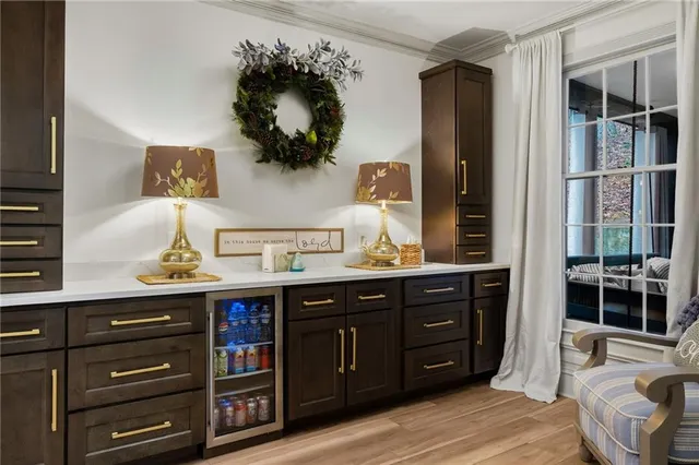a kitchen with stainless steel appliances a refrigerator sink and cabinets