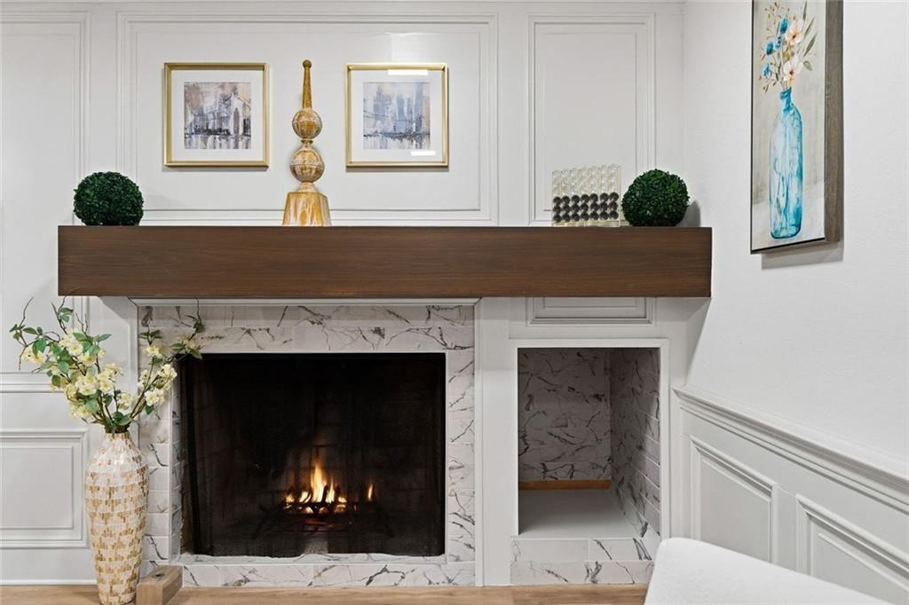 2525 Spalding Drive Atlanta, GA 30350 - Photo 14 of 58 a living room with a fireplace and potted plant