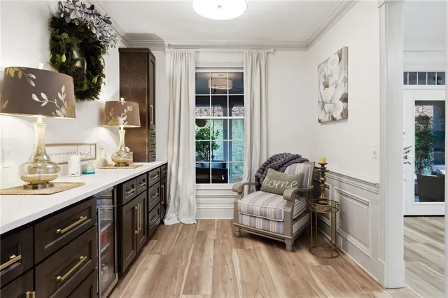 a living room with fireplace furniture and a large window