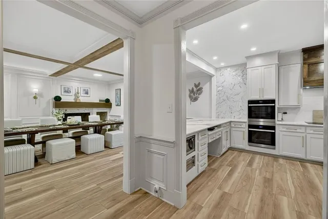 a bedroom with a large bed and a large window