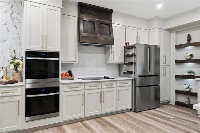 a spacious bedroom with a balcony a bed and a large window
