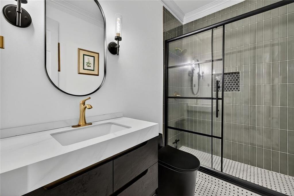 2525 Spalding Drive Atlanta, GA 30350 - Photo 25 of 58 a bathroom with a sink toilet and shower