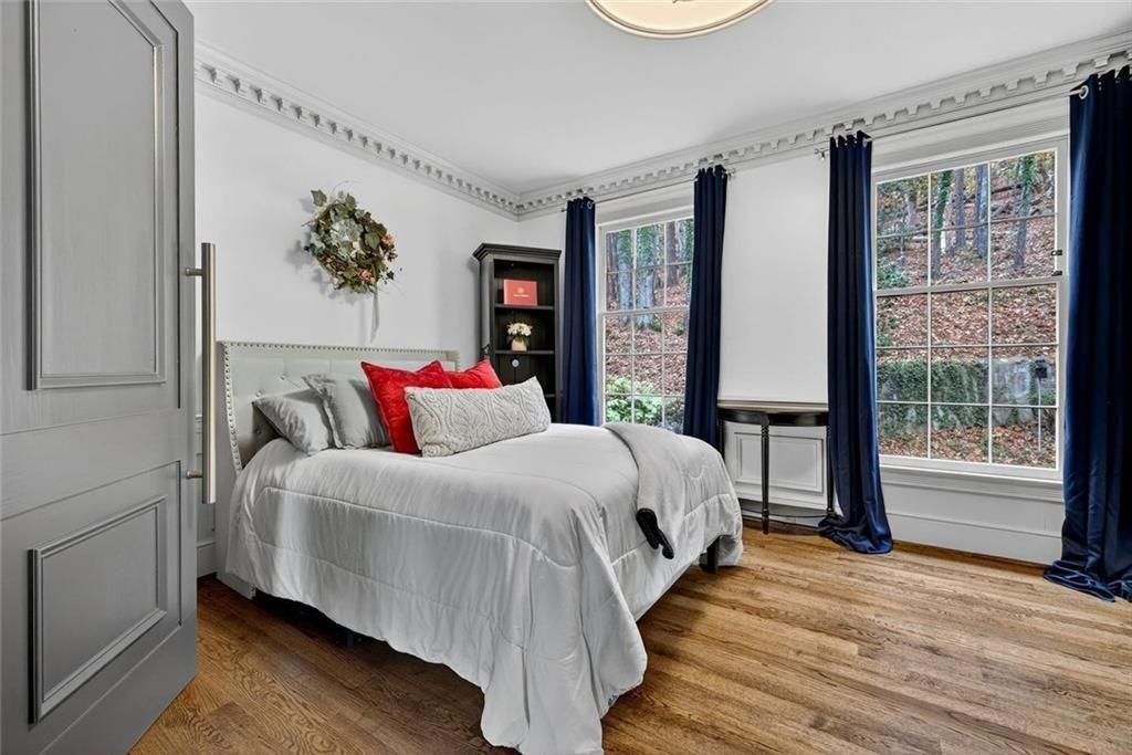 2525 Spalding Drive Atlanta, GA 30350 - Photo 26 of 58 a bedroom with a large bed and a large window