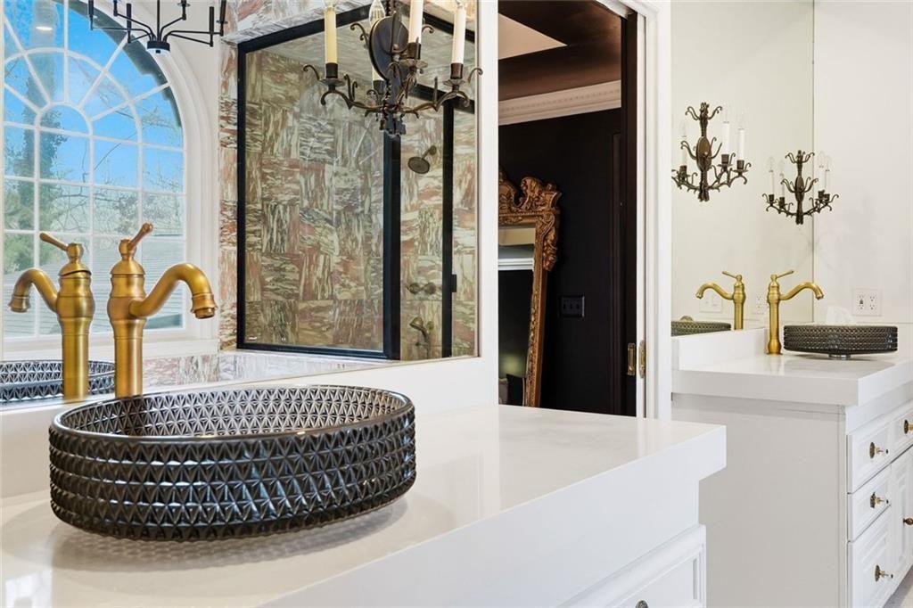 2525 Spalding Drive Atlanta, GA 30350 - Photo 33 of 58 a bedroom with a bed and a dresser