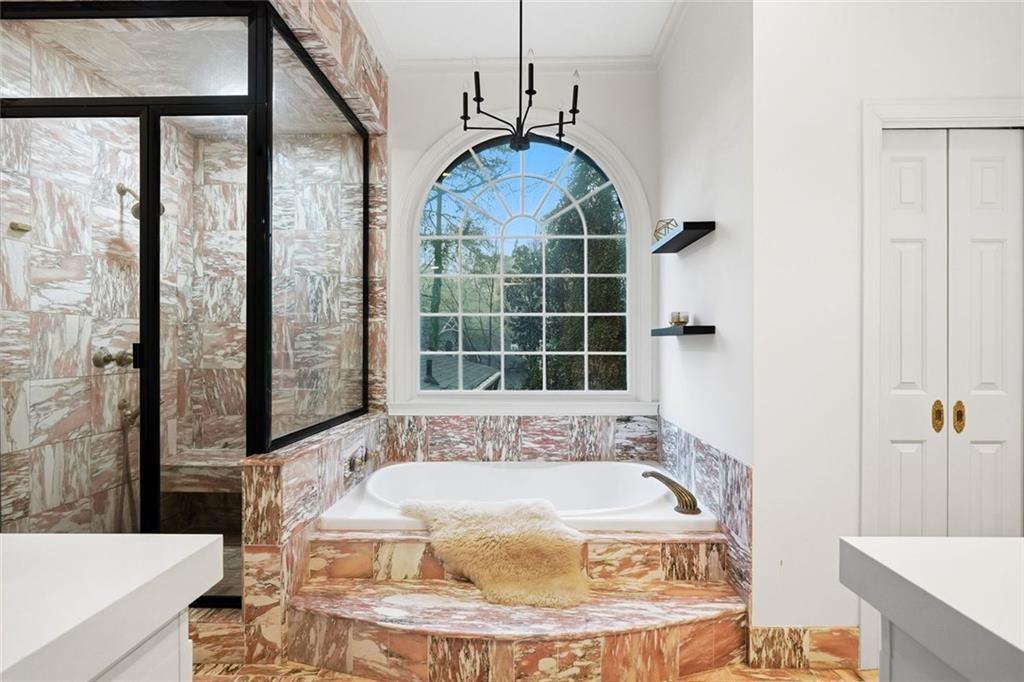 2525 Spalding Drive Atlanta, GA 30350 - Photo 34 of 58 a bath tub sitting in a bathroom next to a window