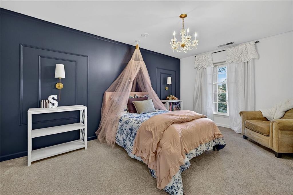 2525 Spalding Drive Atlanta, GA 30350 - Photo 39 of 58 a bed room with a bed and a couch