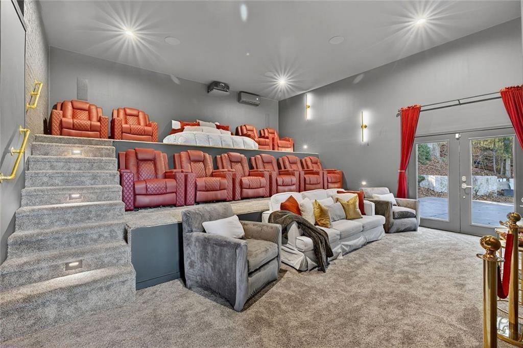 2525 Spalding Drive Atlanta, GA 30350 - Photo 41 of 58 a living room with furniture a ceiling fan and a rug