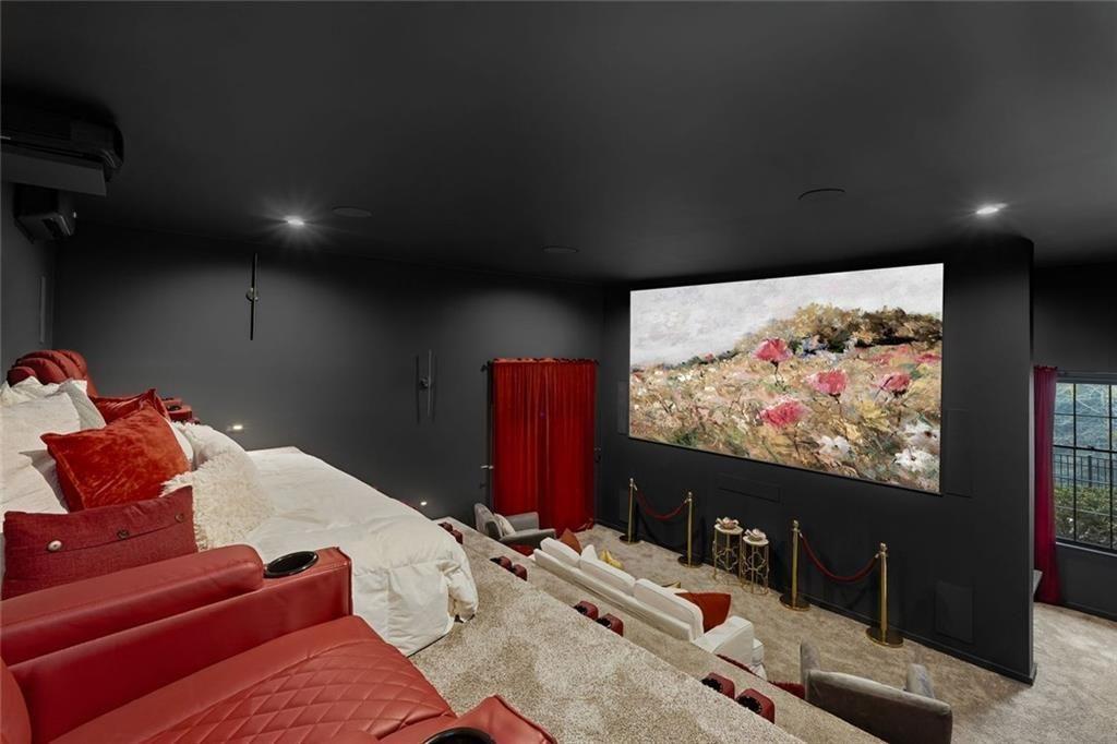 2525 Spalding Drive Atlanta, GA 30350 - Photo 44 of 58 a projector room with furniture and a flat screen tv