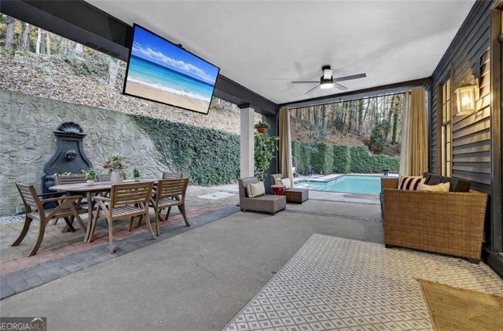 2525 Spalding Drive Atlanta, GA 30350 - Photo 50 of 58 a living room with furniture and a floor to ceiling window