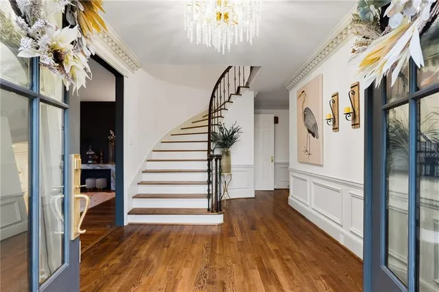 a living room with furniture wooden floor and window