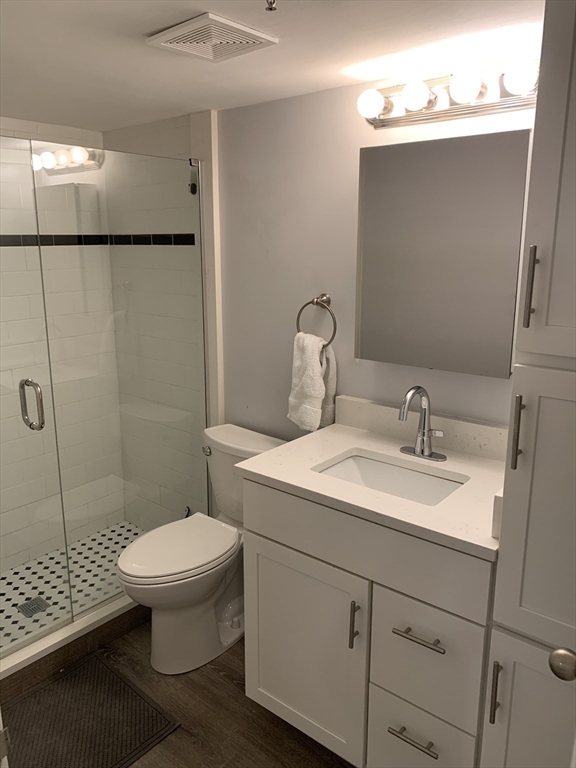 122 Beacon Street, Unit 1 Boston, MA 02116 - Photo 5 of 5 a bathroom with a sink toilet and shower