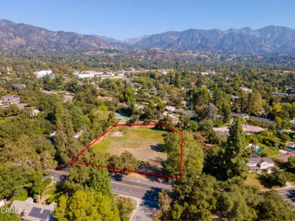 a view of a city with mountains in the background