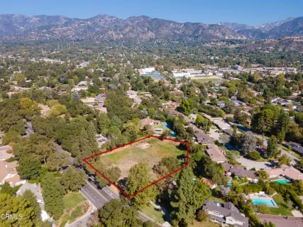 a view of a town with mountains in the background