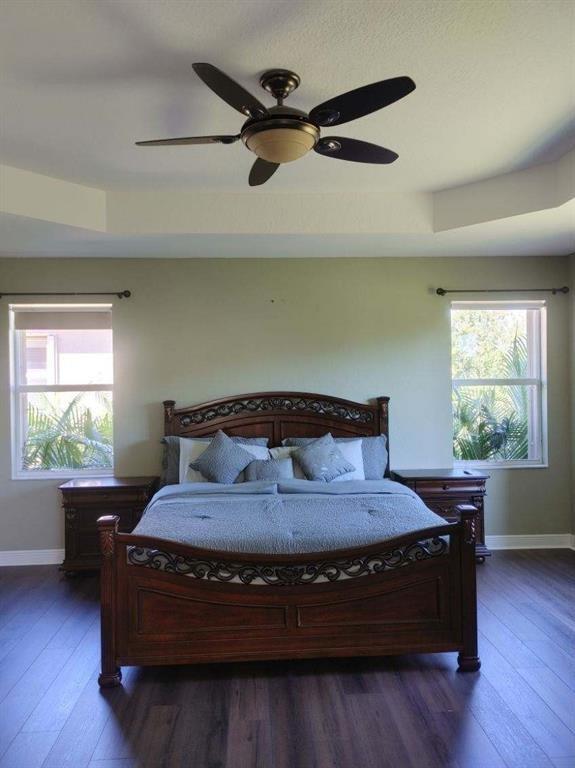 2009 Grey Falcon Circle Southwest Vero Beach, FL 32962 - Photo 9 of 9 a living room with a bed window and a dresser