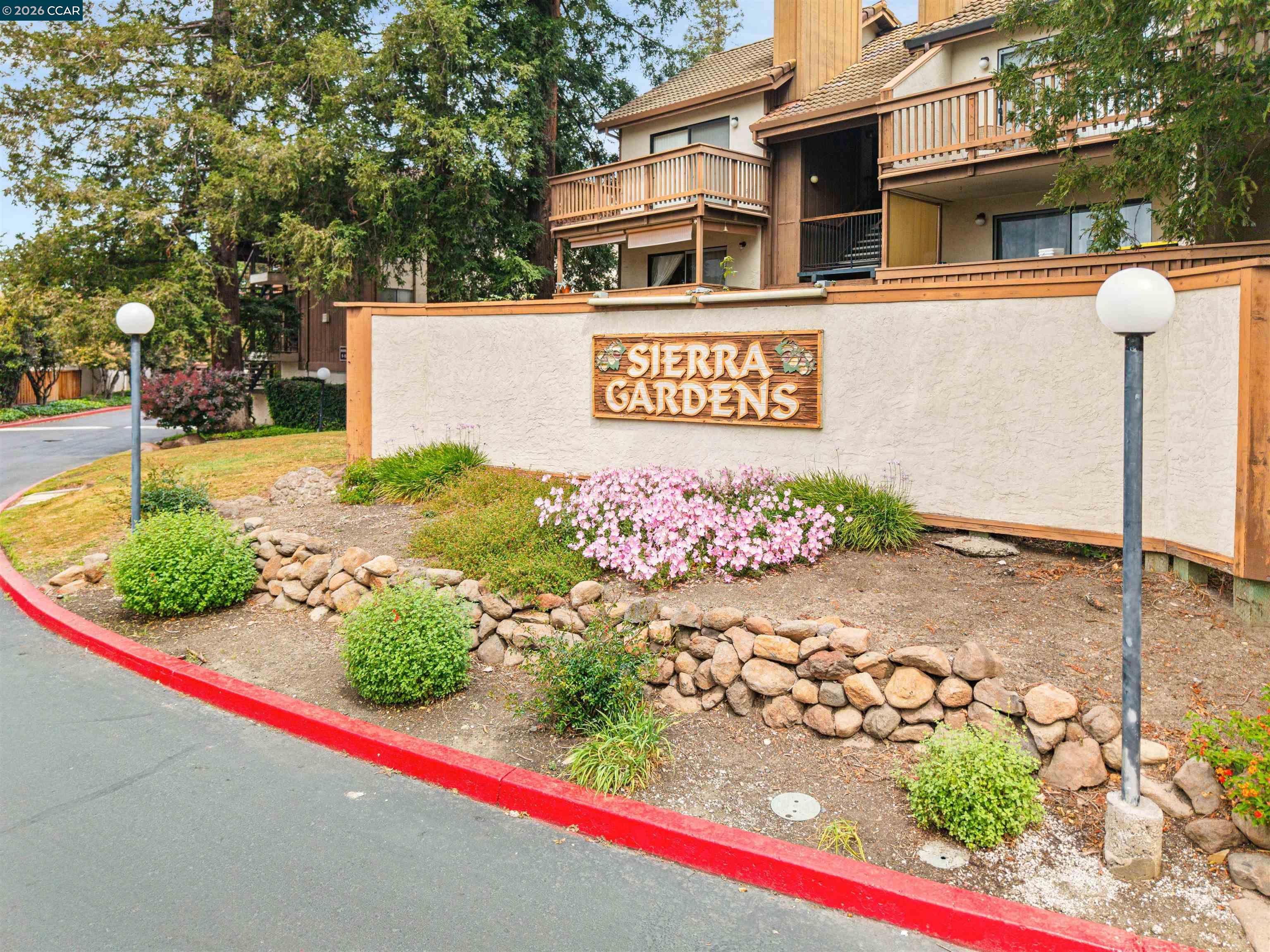 2055 Sierra Road, Unit 106 Concord, CA 94518 - Photo 34 of 37 a view of a street with flower plants