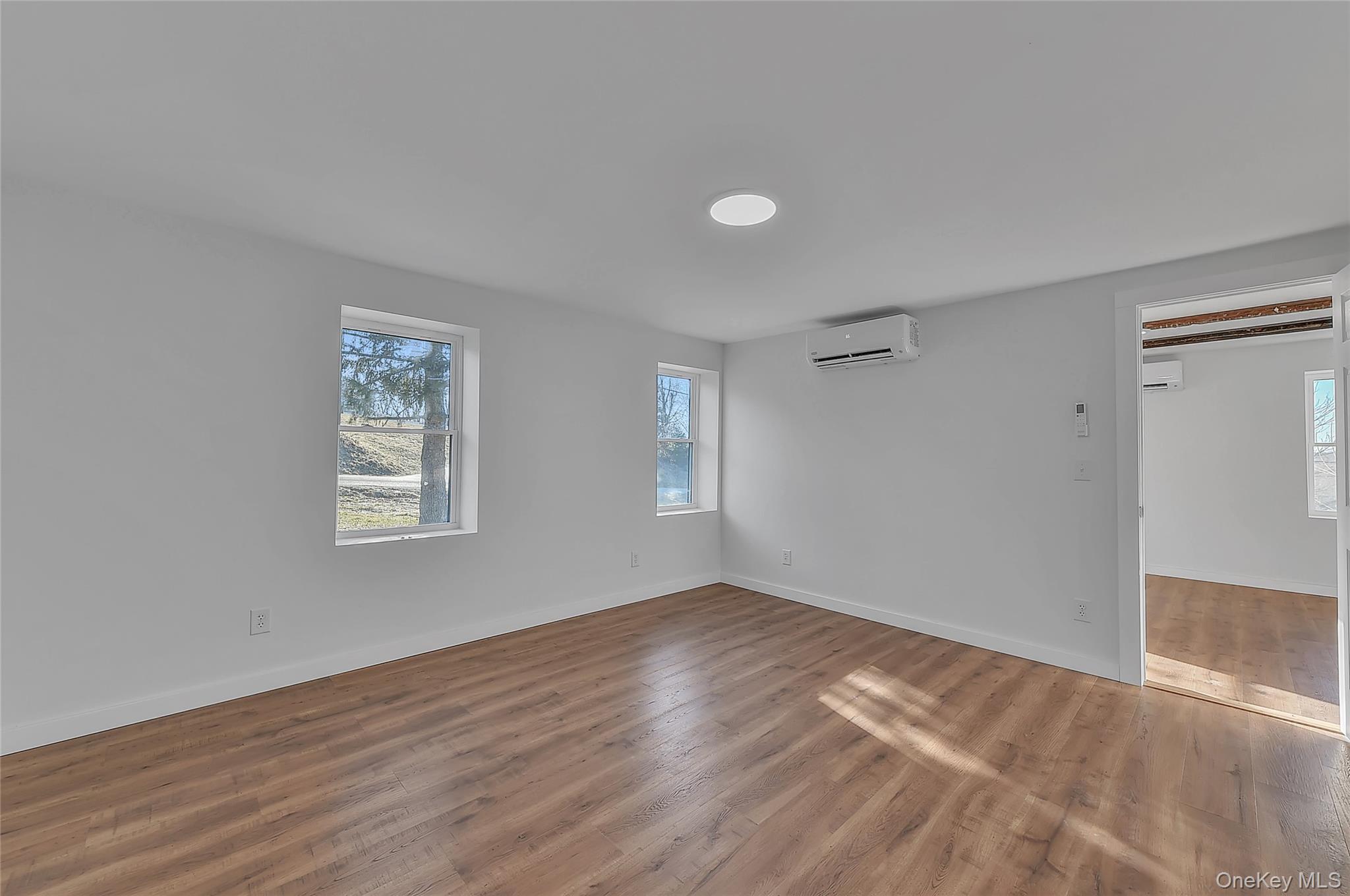 67 Jacobs Road Westtown, NY 10998 - Photo 22 of 36 Unfurnished room featuring wood finished floors and a wall mounted AC