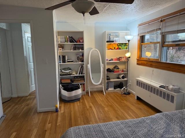 113 Parma Road Island Park, NY 11558 - Photo 7 of 12 a bedroom with furniture and a wooden floor