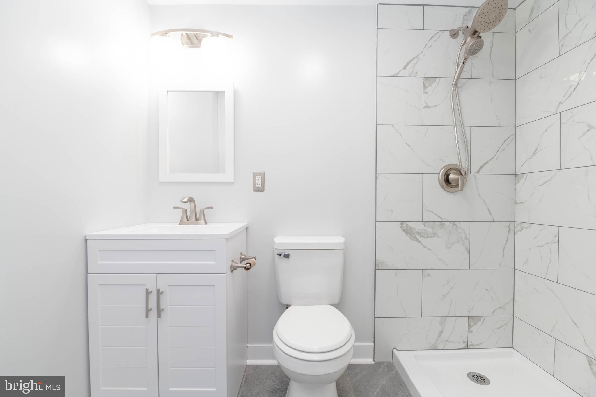 100 South Stuart Street Baltimore, MD 21221 - Photo 16 of 49 Renovated Primary Bath with Walk-in Shower