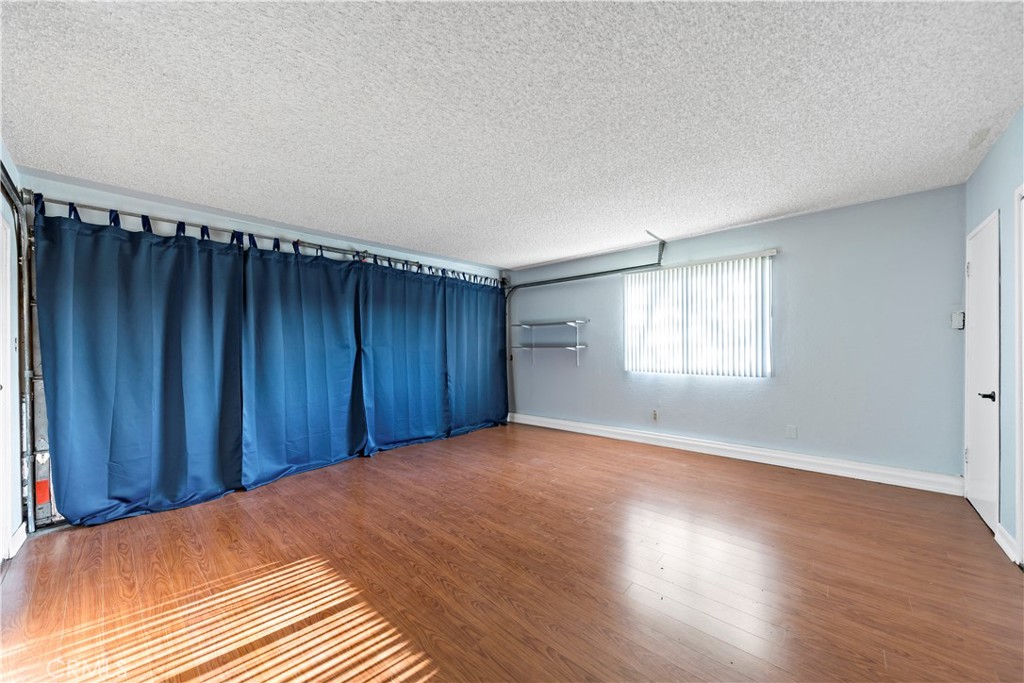 3524 Whitingham Drive West Covina, CA 91792 - Photo 17 of 39 an empty room with wooden floor and windows