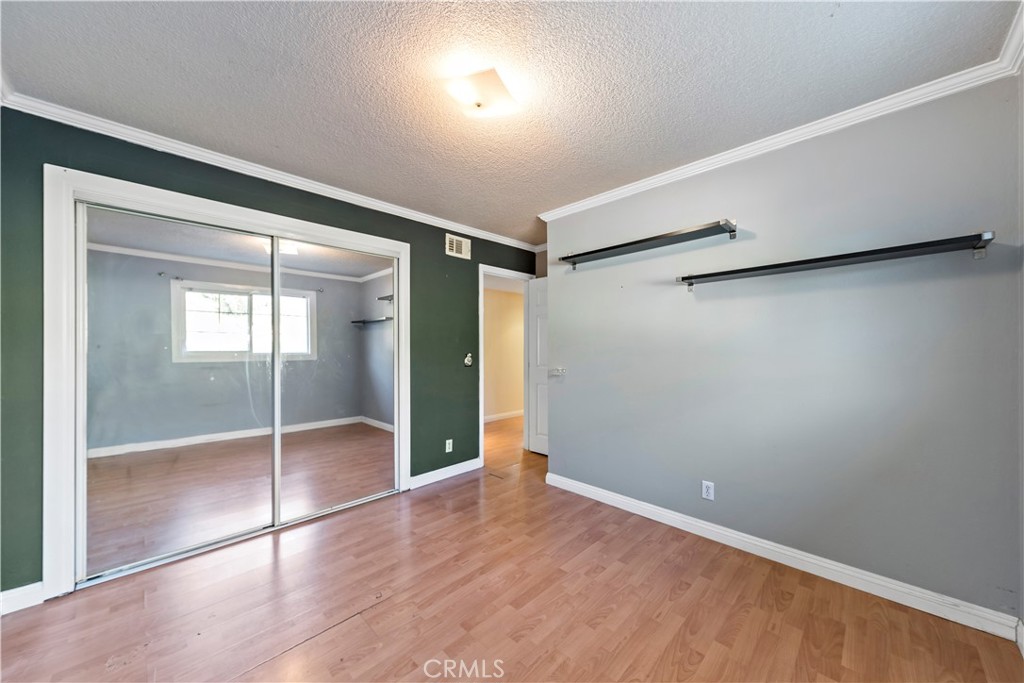 3524 Whitingham Drive West Covina, CA 91792 - Photo 21 of 39 an empty room with wooden floor and windows