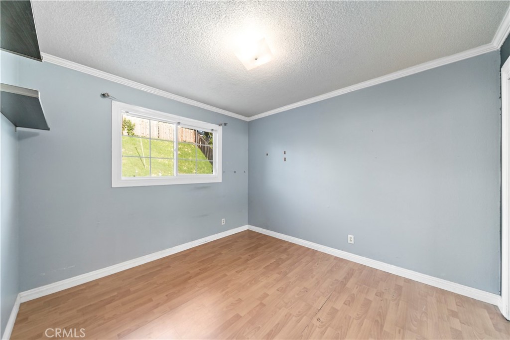 3524 Whitingham Drive West Covina, CA 91792 - Photo 22 of 39 an empty room with wooden floor and windows