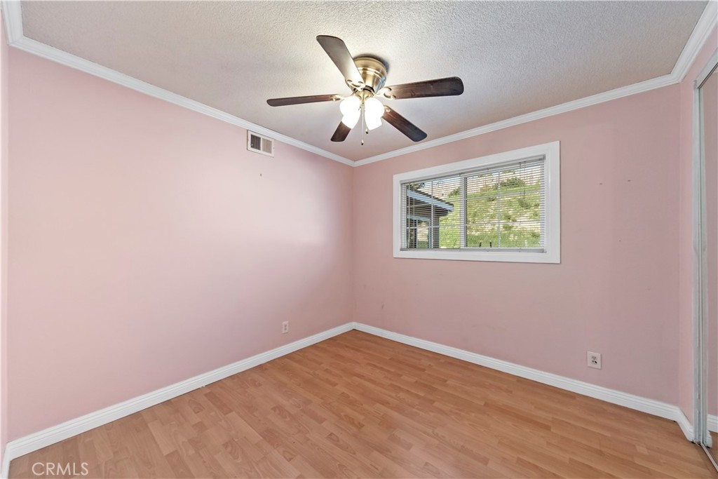 3524 Whitingham Drive West Covina, CA 91792 - Photo 24 of 39 an empty room with wooden floor and ceiling fan