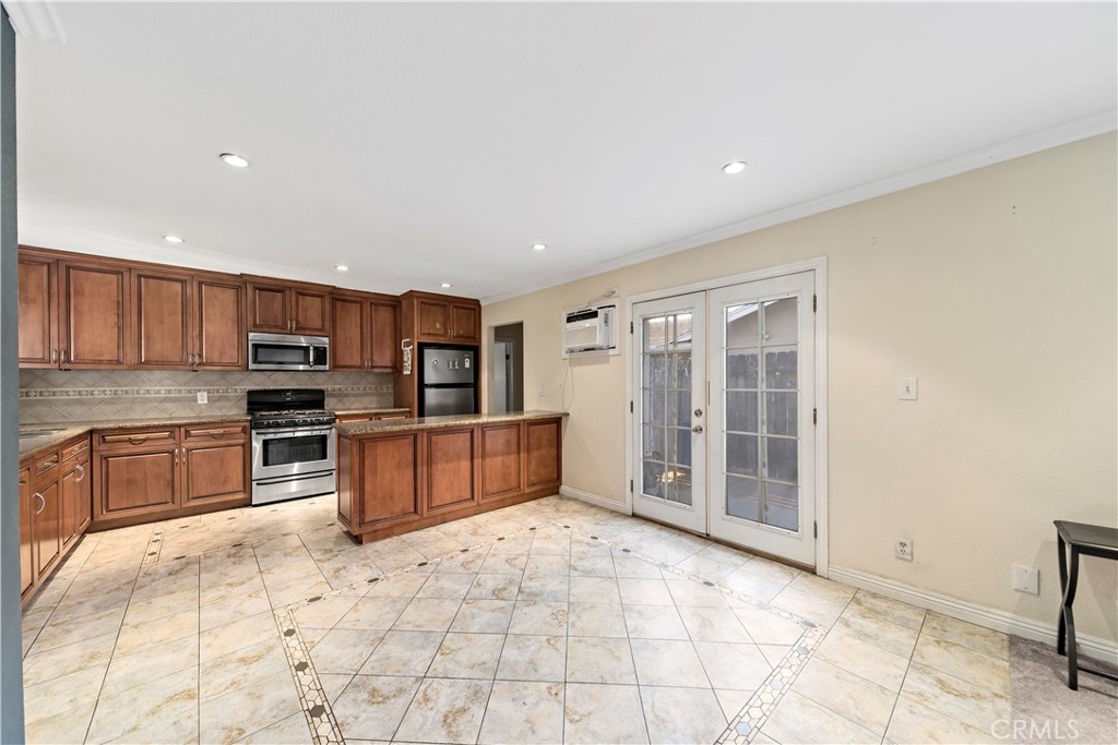 3524 Whitingham Drive West Covina, CA 91792 - Photo 6 of 39 a large kitchen with stainless steel appliances and cabinets