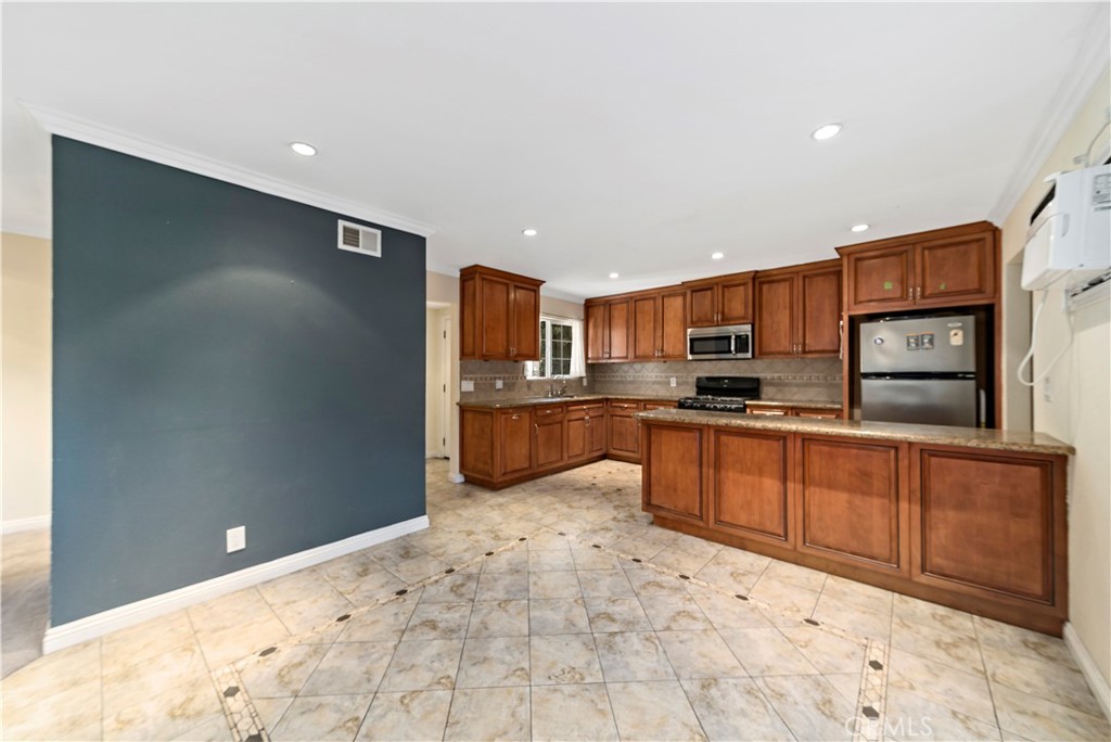 3524 Whitingham Drive West Covina, CA 91792 - Photo 7 of 39 a kitchen with stainless steel appliances granite countertop a refrigerator and a stove top oven