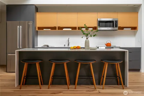 a kitchen with a stove and a microwave