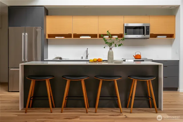 a kitchen with a stove and a microwave