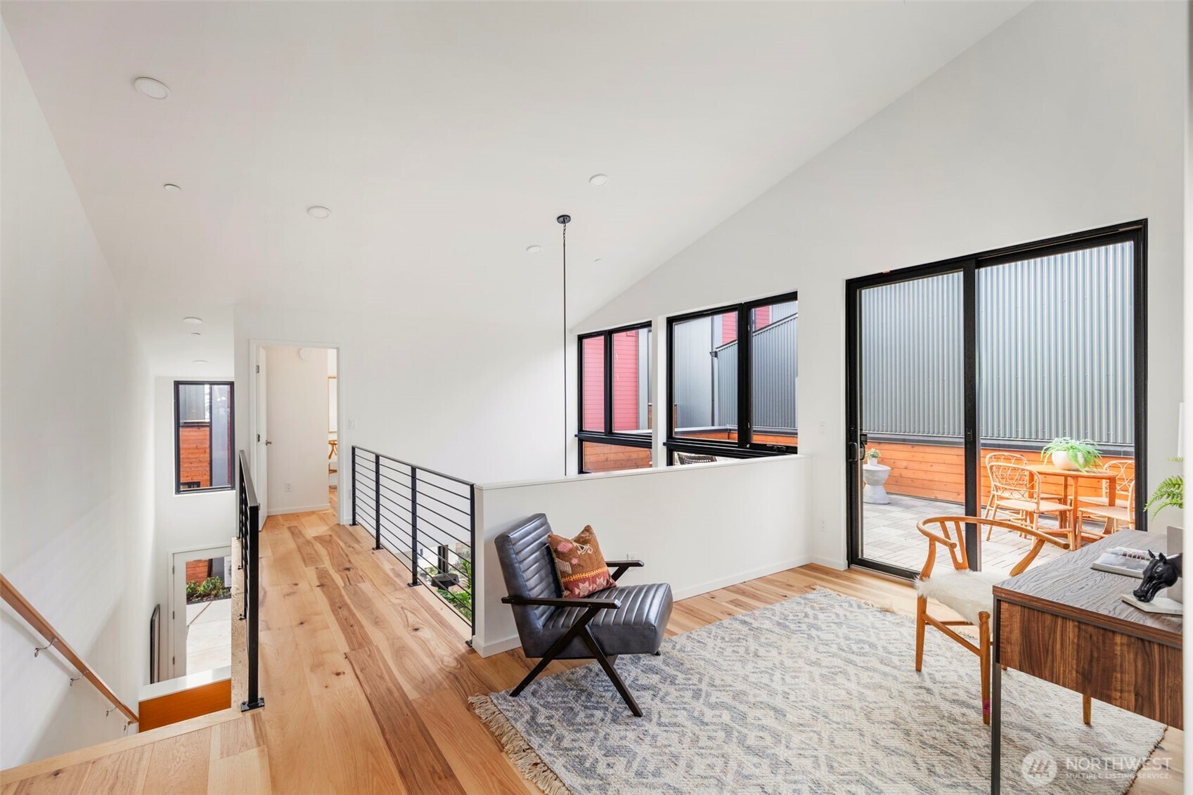 224 Canopy Path Northwest Bainbridge Island, WA 98110 - Photo 18 of 32 a living room with furniture and large windows