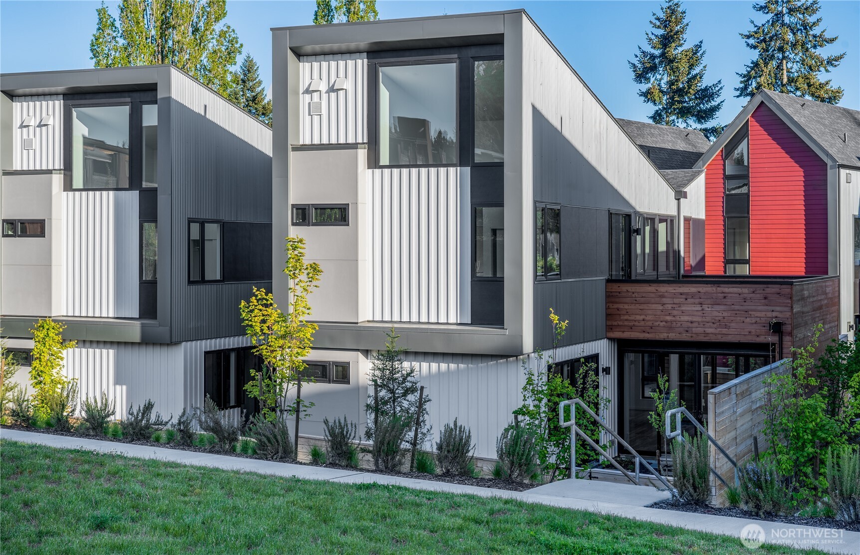 224 Canopy Path Northwest Bainbridge Island, WA 98110 - Photo 2 of 32 a house view with a garden space