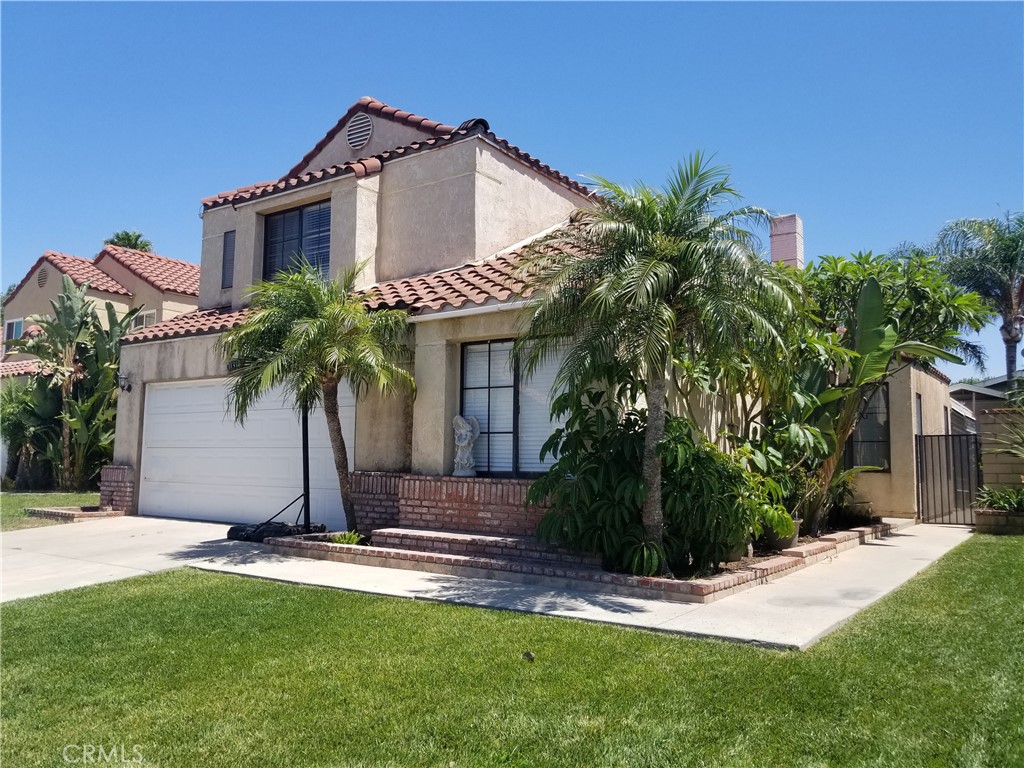 11318 Price Court Riverside, CA 92503 - Photo 1 of 1 a front view of a house with a yard and garage