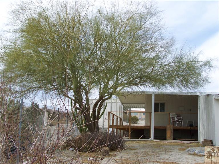 15303 Country View Road Whitewater, CA 92282 - Photo 2 of 25 a front view of a house with a yard