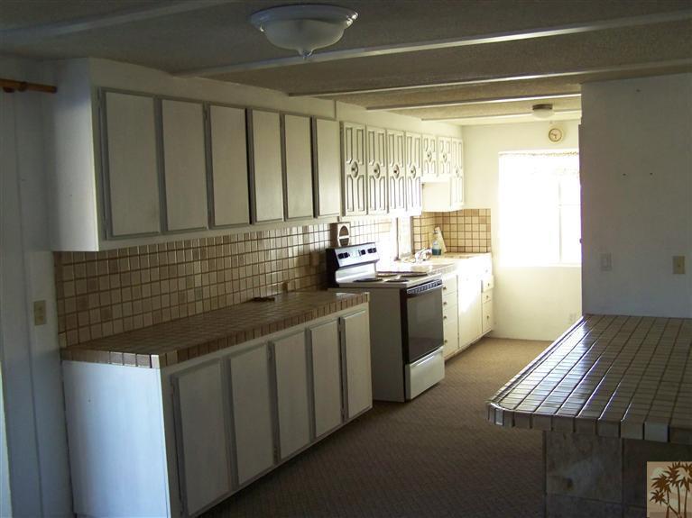 15303 Country View Road Whitewater, CA 92282 - Photo 15 of 25 a kitchen that has a sink and a stove