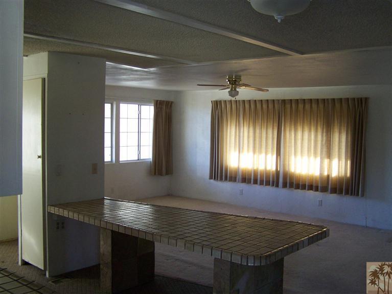 15303 Country View Road Whitewater, CA 92282 - Photo 16 of 25 a room with chandelier and window