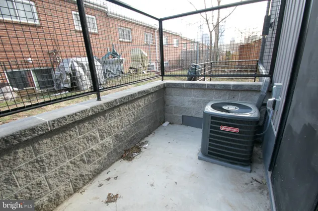 an empty room with closet and a bathroom