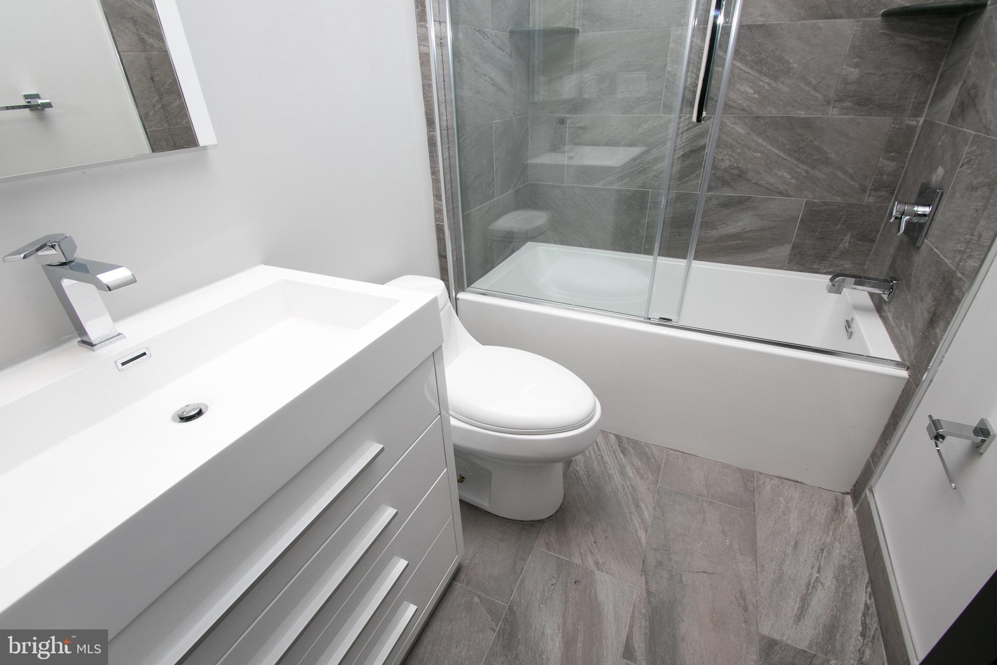 755 North Capitol Street Philadelphia, PA 19130 - Photo 17 of 47 a bathroom with a sink a toilet and shower