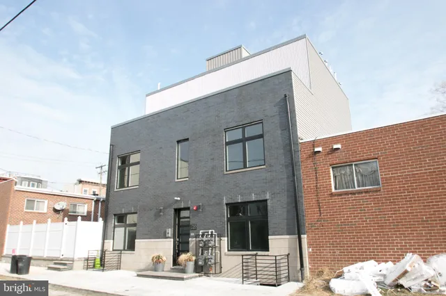 a front view of a building with a street