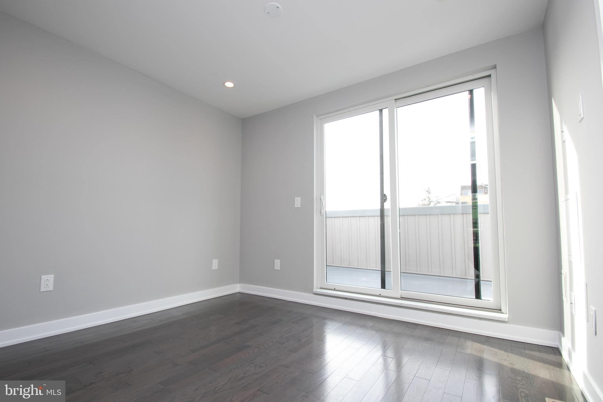 755 North Capitol Street Philadelphia, PA 19130 - Photo 25 of 47 a view of empty room with wooden floor and fan