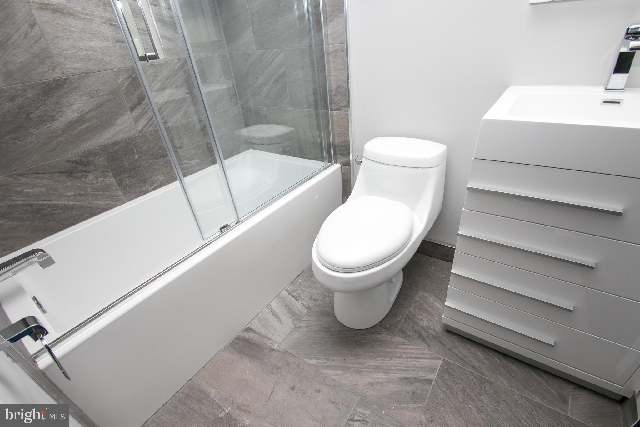 755 North Capitol Street Philadelphia, PA 19130 - Photo 26 of 47 a white toilet sitting next to a bathroom sink