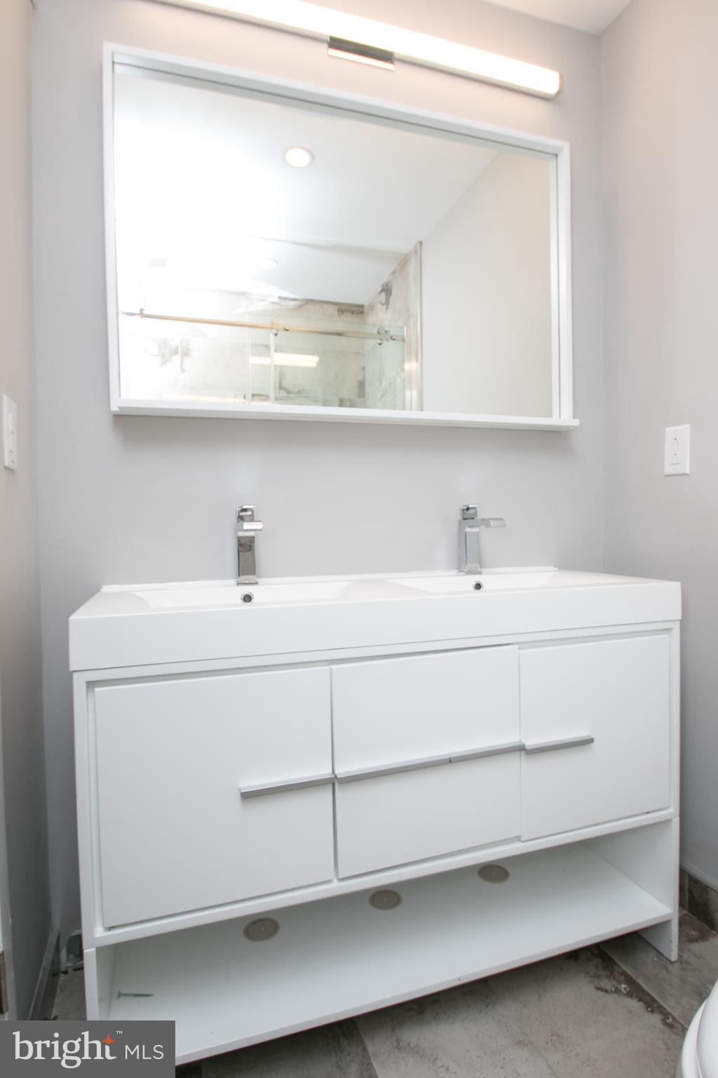 755 North Capitol Street Philadelphia, PA 19130 - Photo 29 of 47 a bathroom with a sink and a mirror
